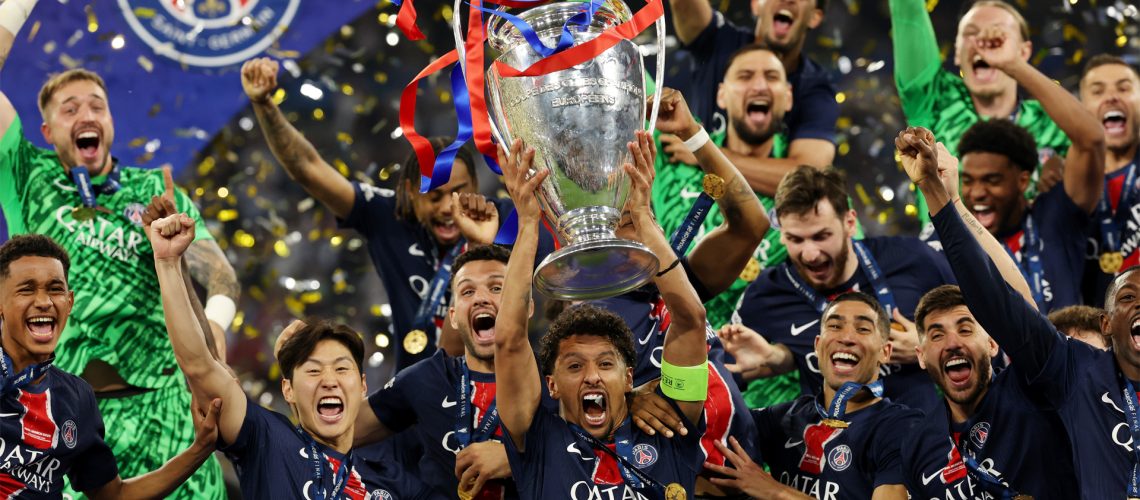 Paris Saint-Germain captain Marquinhos lifts the trophy after his team's May 2025 Champions League final victory over Inter Milan.