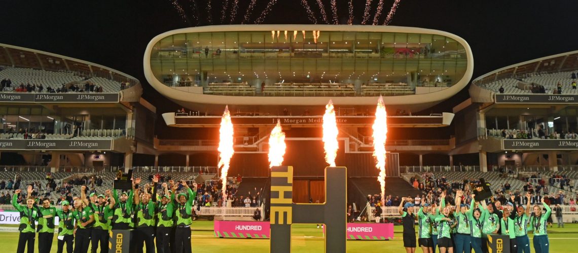 Champions The Southern Braves (l) and the Oval Invincibles (r) parade their trophies in front of the media centre and the Compton (l) and Edrich Stands after The Hundred Final match between Birmingham Phoenix Men and Southern Brave Men at Lord's Cricket Ground on August 21, 2021 in London, England.