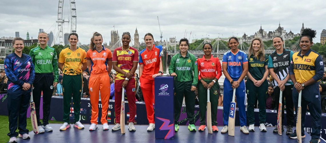Team captains for each team pose together with the trophy in front of a London cityscape ahead of the Women's T20 World Cup 2026 cricket.