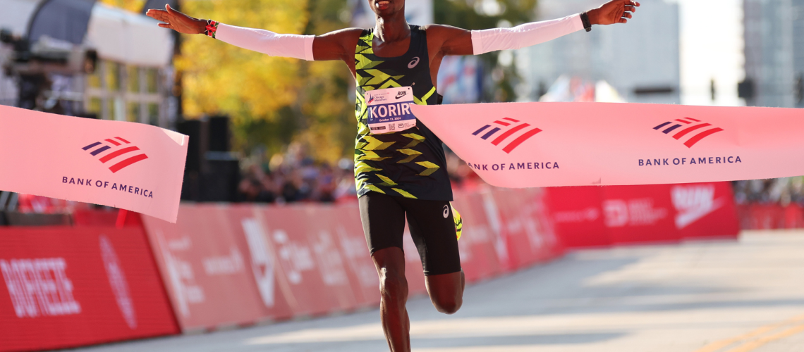 John Korir of Kenya celebrates as he crosses the finish line to win the 2024 Chicago Marathon professional men's division at Grant Park on October 13, 2024 in Chicago, Illinois.