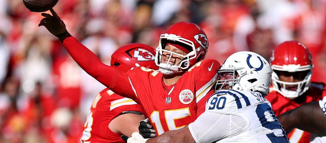 The Kansas City Chiefs' Patrick Mahomes throwing the ball under pressure from the Indianapolis Colts' Grover Stewart