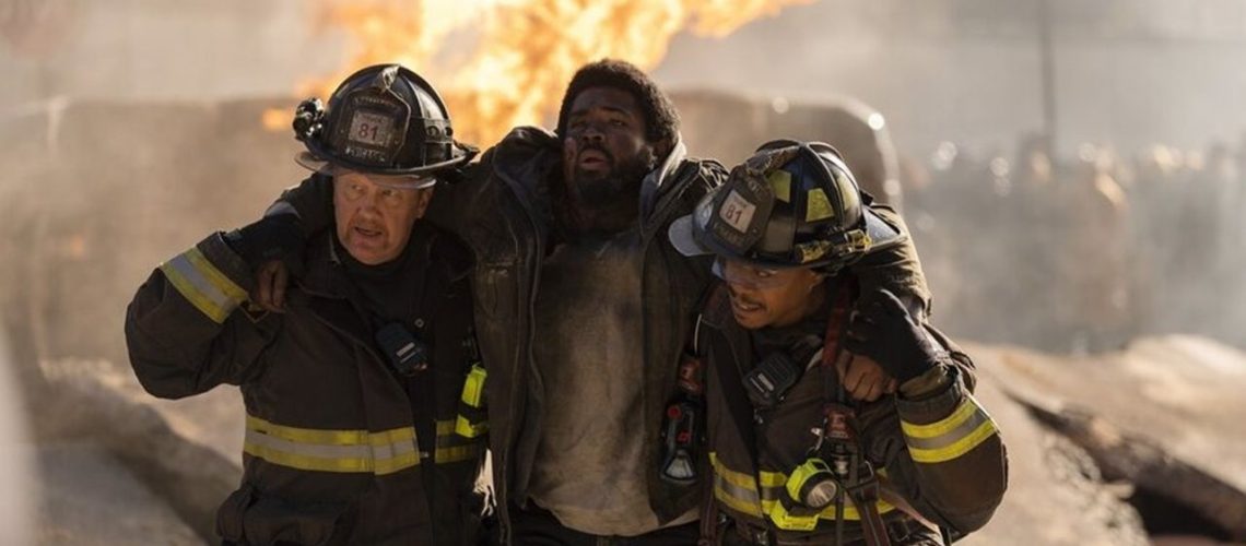 Randy 'Mouch' McHolland (Christian Stolte) and Darren Ritter (Daniel Kyri) save an injured man from the flames in "Chicago Fire" Season 13 Episode 11.