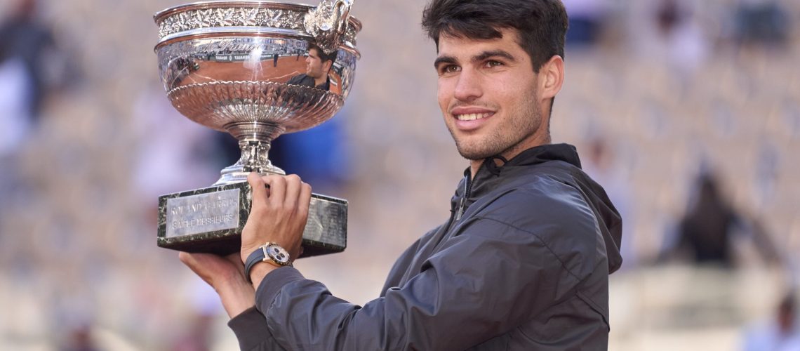 Carlos Alcaraz lifting the French Open 2024 Trophy aloft