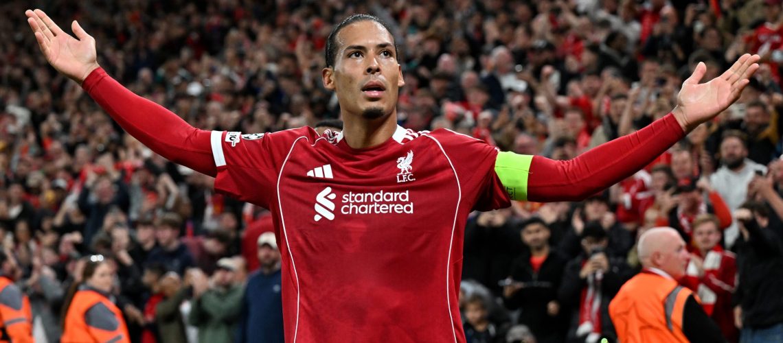 Virgil van Dijk of Liverpool celebrates scoring his team's third goal during the UEFA Champions League 2025/26 League Phase MD1 match between Liverpool FC and Atletico de Madrid at Anfield on September 17, 2025 in Liverpool, England.