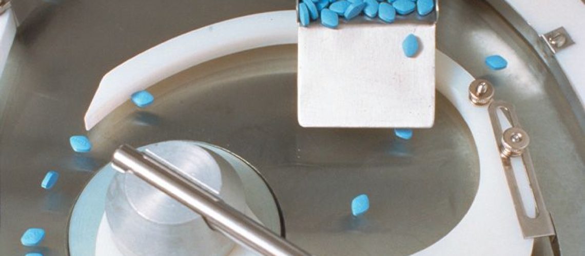 Blue Viagra pills in a factory