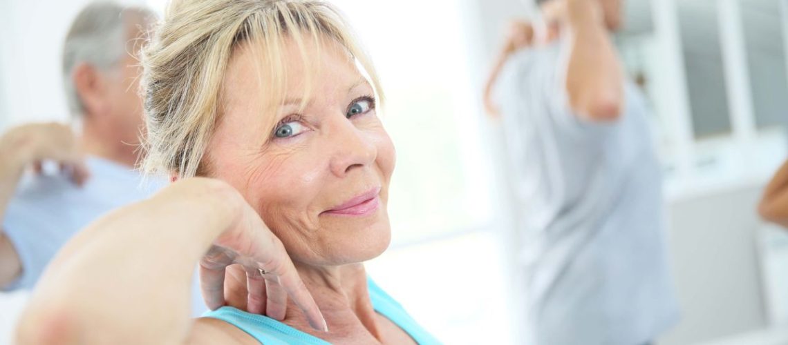 a photo of a woman in her 60's working out