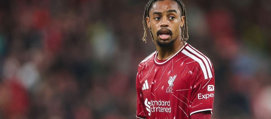 Bradley Barcola, wearing the red of Liverpool, looks on during a Premier League 2026/27 game.