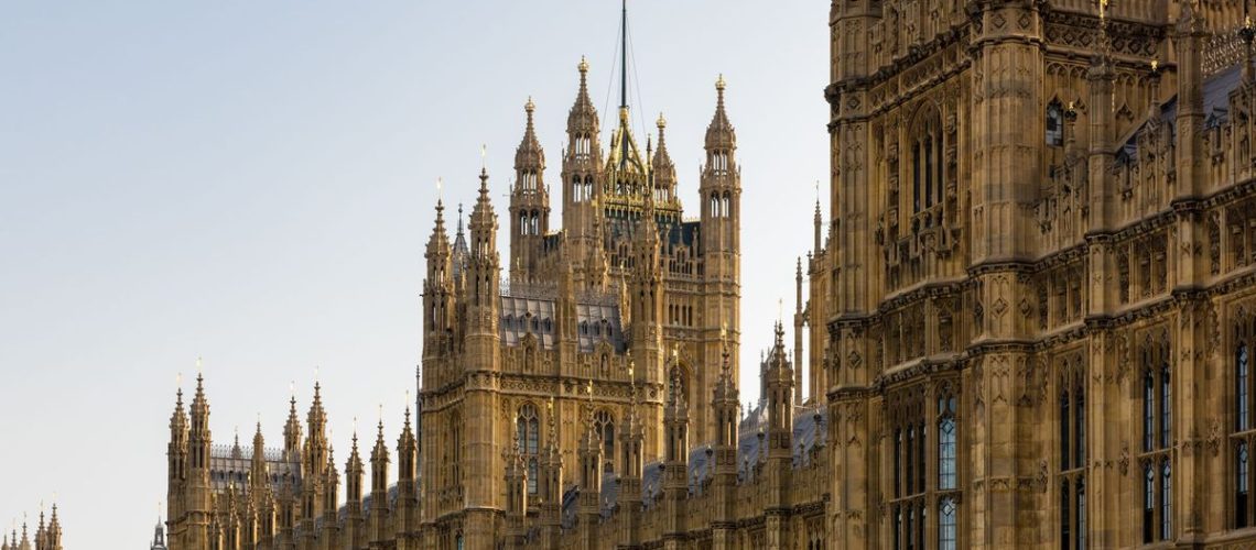 The UK house of parliament flying the Union flag