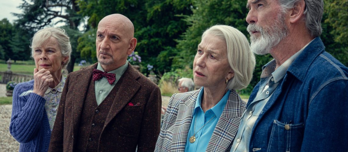 L-R: Celia Imrie, Ben Kingsley, Helen Mirren, and Pierce Brosnan stand side-by-side in a scene from Netflix's "Thursday Murder Club" movie