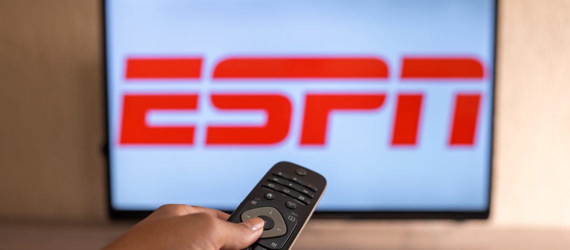 ESPN logo on TV with remote