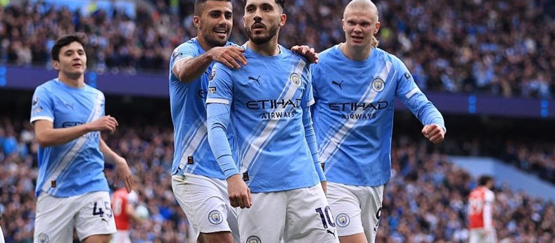 Rayan Cherki of Manchester City celebrates scoring their 1st goal during the Premier League match between Manchester City and Arsenal at Etihad Stadium.