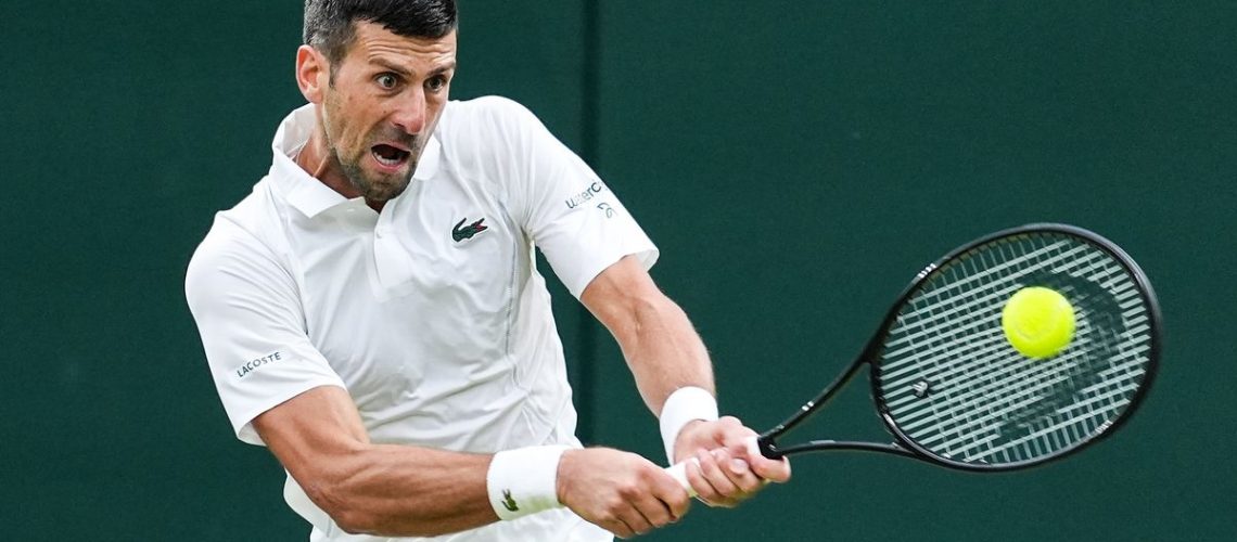Novak Djokovic of Serbia plays a backhand in the Men