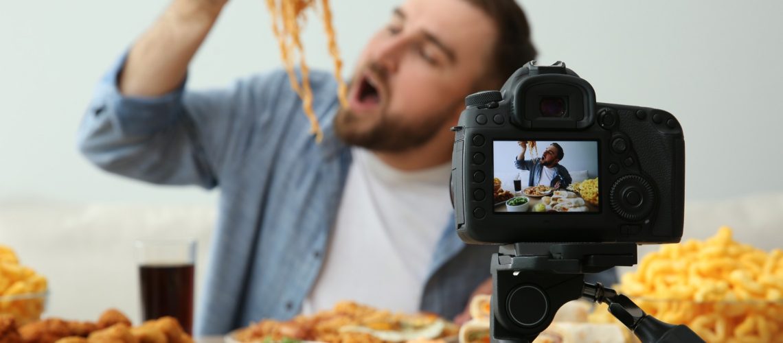 Food blogger recording eating show
