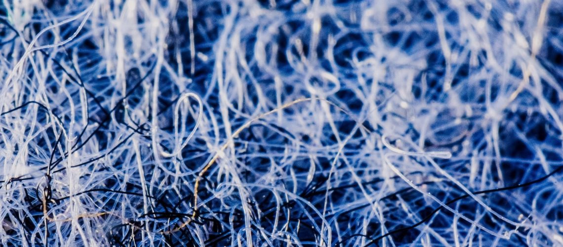 Study: Reducing microplastic fiber shedding from hand-washed polyester. Image Credit: Katarzyna Ledwon / Shutterstock