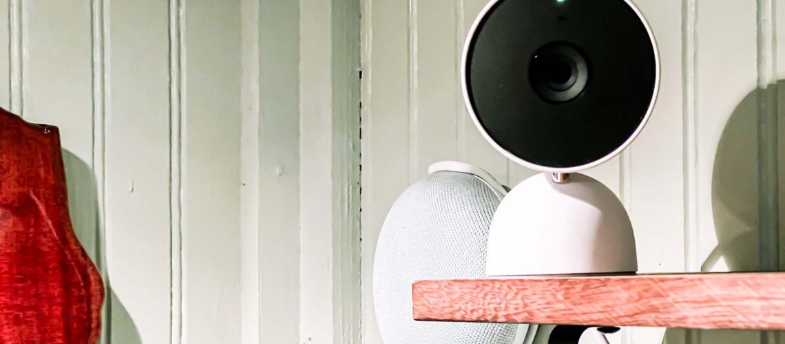 Nest Cam (indoor, wired) on bookshelf