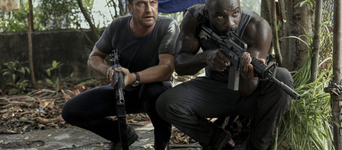 Gerard Butler as Brodie Torrance and Mike Colter as Louis Gaspare in "Plane."