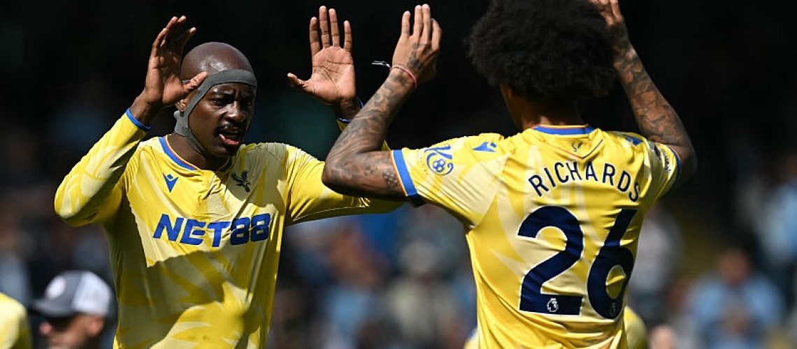 Crystal Palace's French striker #14 Jean-Philippe Mateta (C) and Crystal Palace's US defender #26 Chris Richards (R) prepare ahead of kick-off in the English Premier League football match between Manchester City and Crystal Palace at the Etihad Stadium in Manchester, north west England, on April 12, 2025.