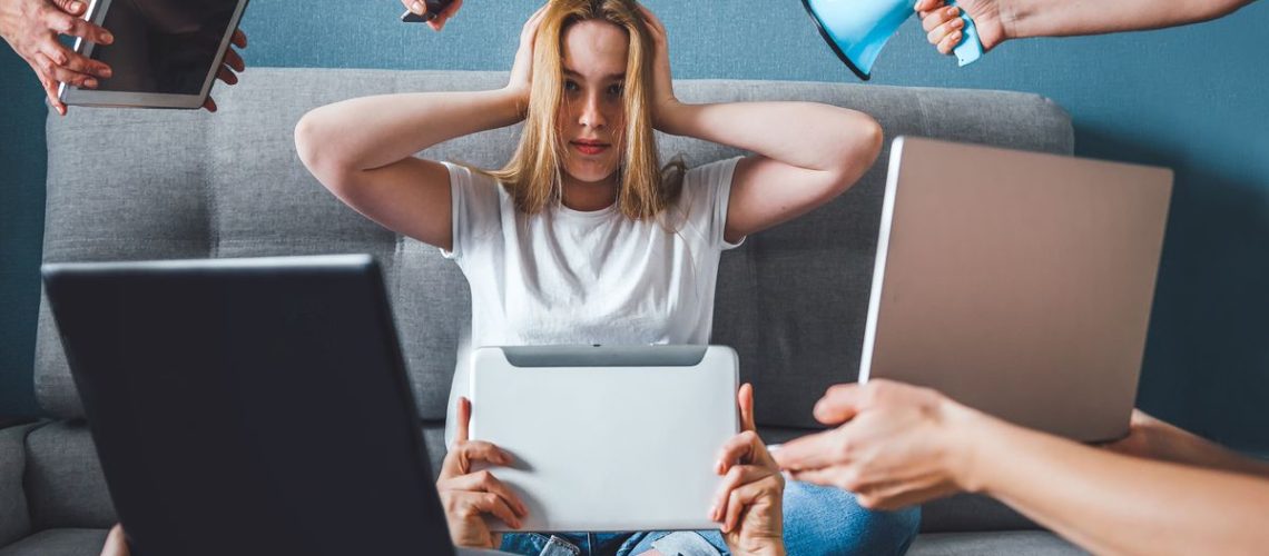 A person being overwhelmed with digital info.