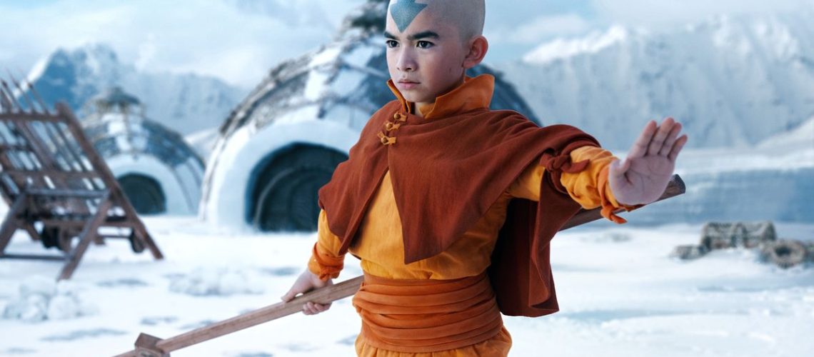 Avatar Aang (Gordon Cormier) stands with his staff in the Southern Water Tribe in Netflix