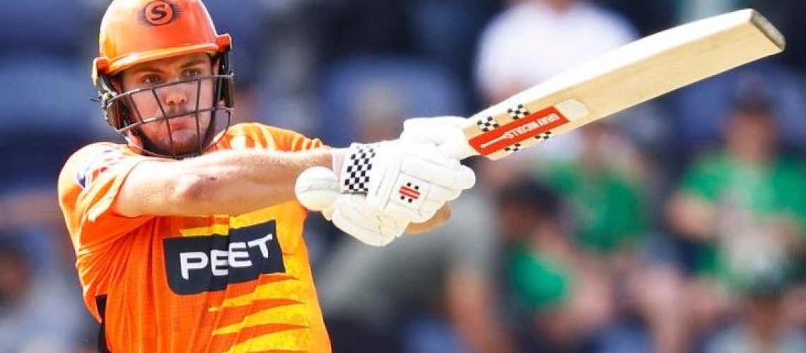 Aaron Hardie, wearing bright orange kit, orange helmet and white gloves, swings a cricket bat ahead of the start of the 2023 Big Bash League live stream