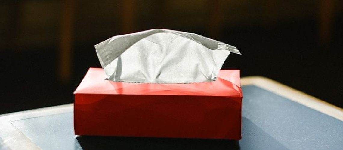 A table with a tissue box