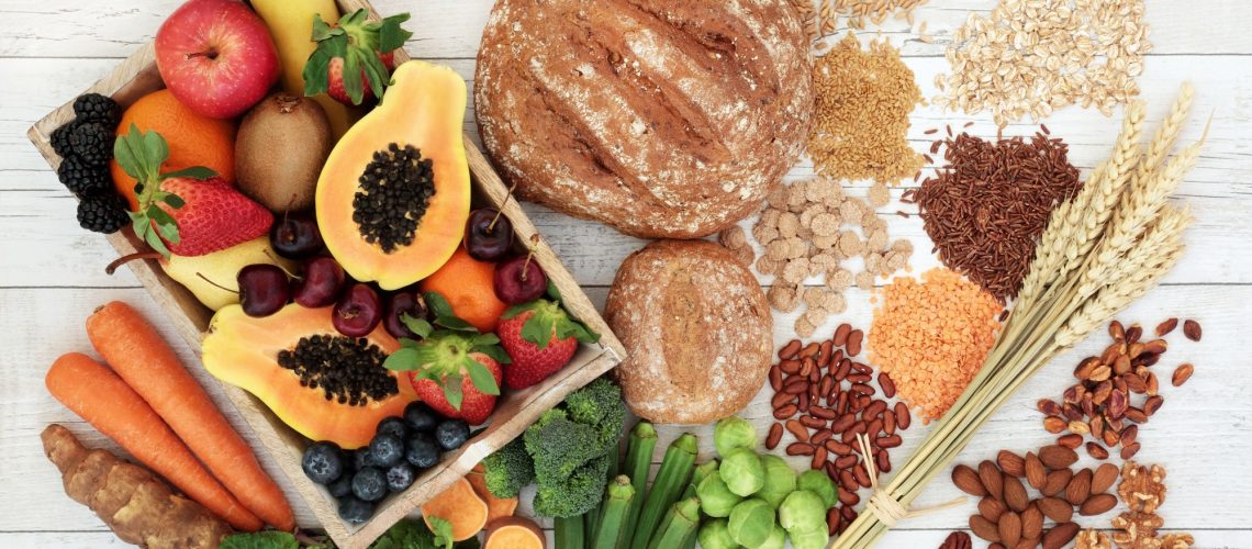 Healthy high fibre diet food concept with legumes, fruit, vegetables, wholegrain bread, cereals, grains, nuts and seeds