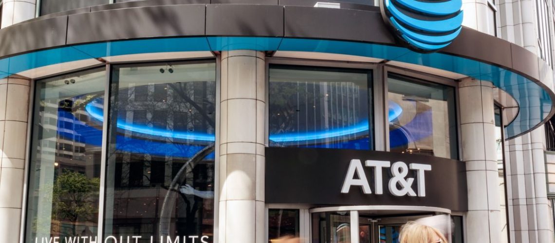 An AT&T store with people walking in front of it