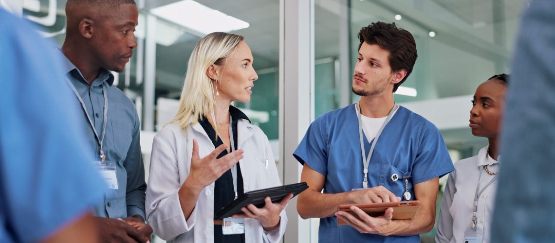 Healthcare staff and leader talking clinic results