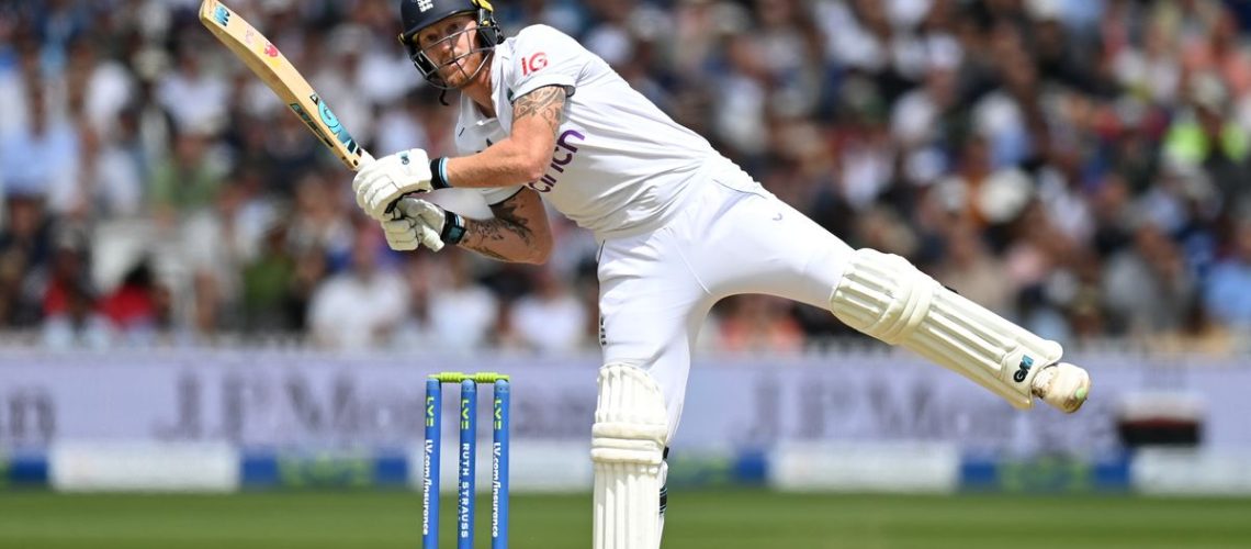 England captain Ben Stokes, dressed in traditional cricket whites and pads, hits out for six ahead of the India vs England Test match 2024.
