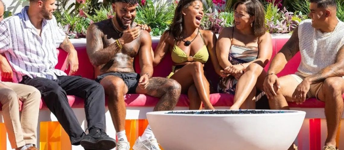'Love Island USA' season 7 contestants gathered on a sofa in the villa.