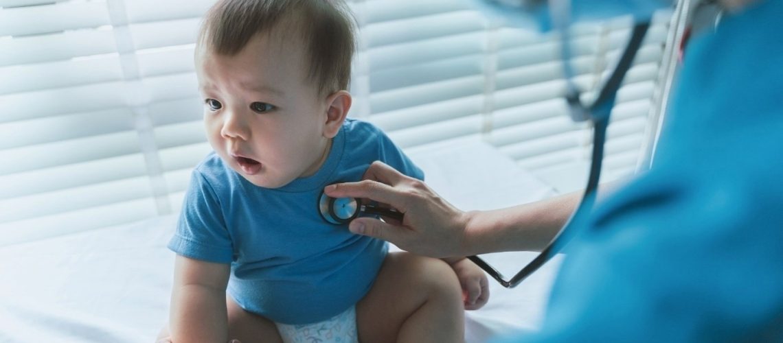 Doctors with baby patient