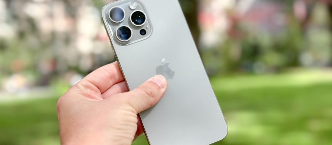 iPhone 15 Pro Max in hand