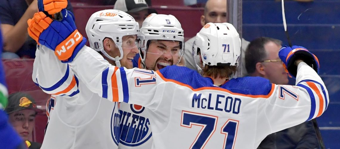 Cody Ceci #5 of the Edmonton Oilers (C) celebrates with teammates after his goal during the second period in Game Seven of the Second Round of the 2024 Stanley Cup Playoffs at Rogers Arena on May 20, 2024