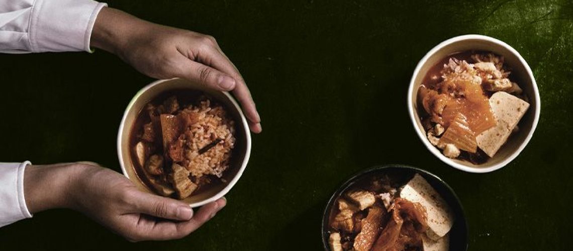 Three bowls of kimchi on a table