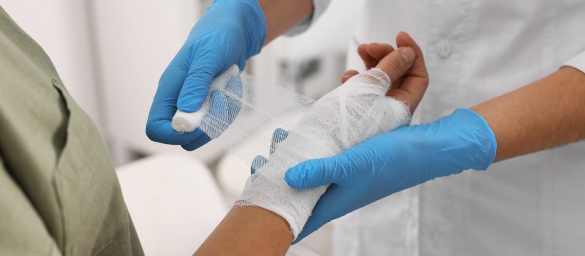 Doctor bandaging patient