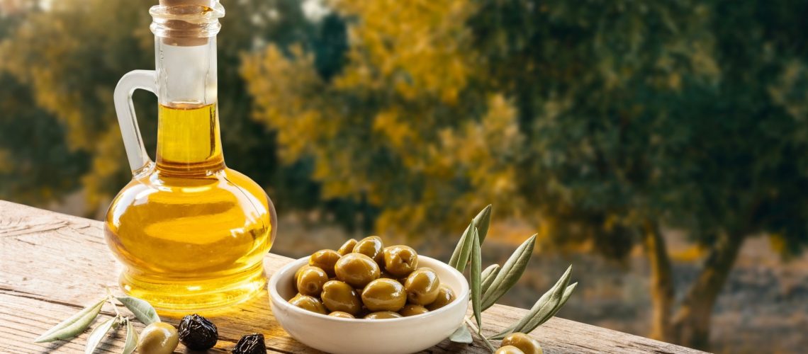 Green olive oil and olive oil concept